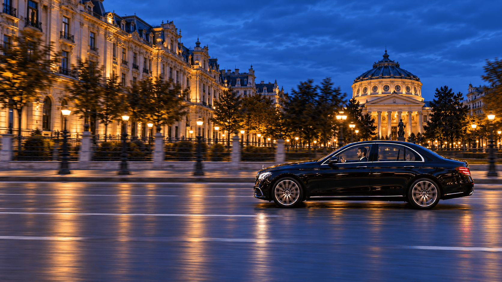 A black BlackCab sedan at night in front of the Romanian Athenaeum, Bucharest